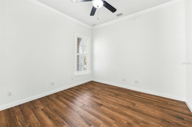 spare room with crown molding, ceiling fan, and dark wood-type flooring