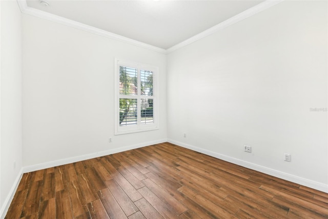 unfurnished room with crown molding and dark hardwood / wood-style flooring