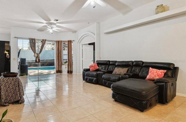 living room with light tile patterned floors and ceiling fan