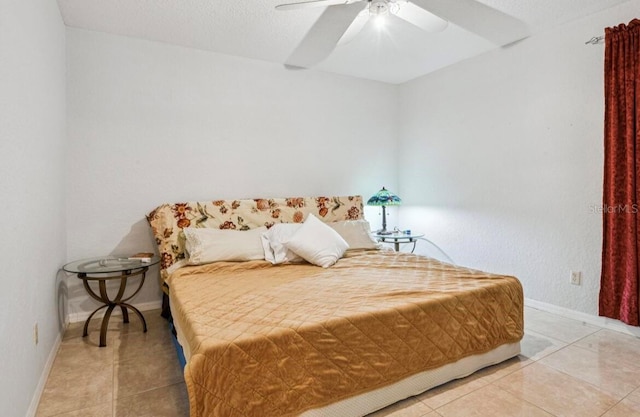 bedroom with tile patterned flooring and ceiling fan