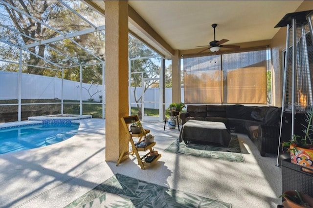 view of pool with a lanai, a patio area, outdoor lounge area, and ceiling fan