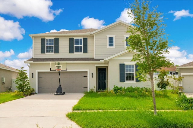 view of front of property featuring a garage and a front lawn