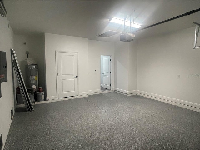 garage featuring a garage door opener, electric panel, and water heater