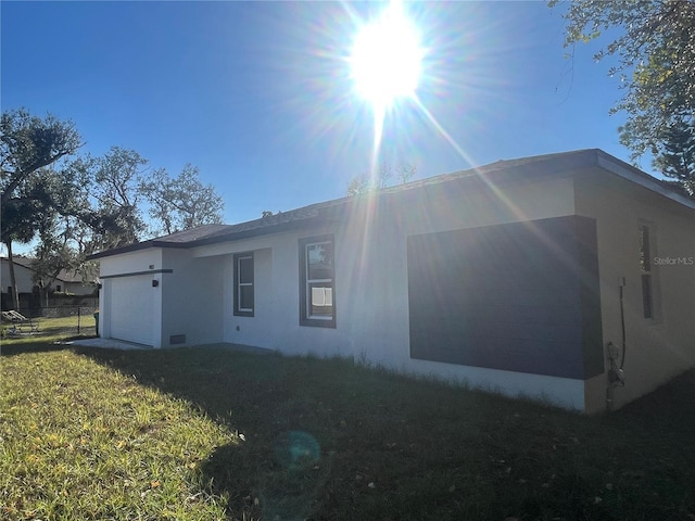 rear view of property with a lawn