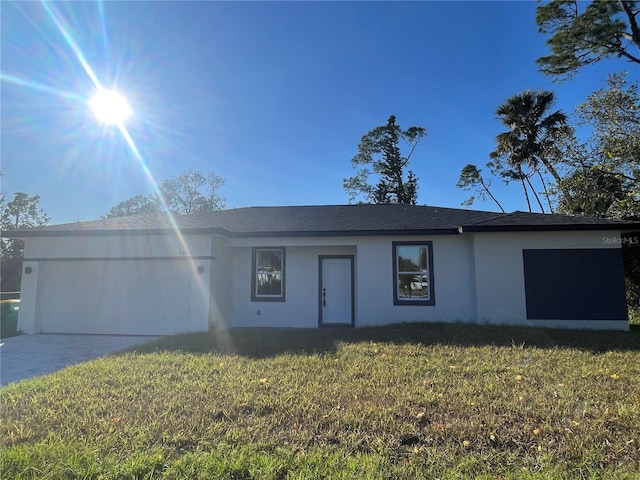 single story home featuring a front yard