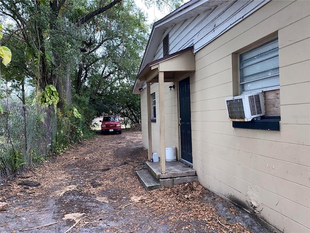 view of side of property featuring cooling unit