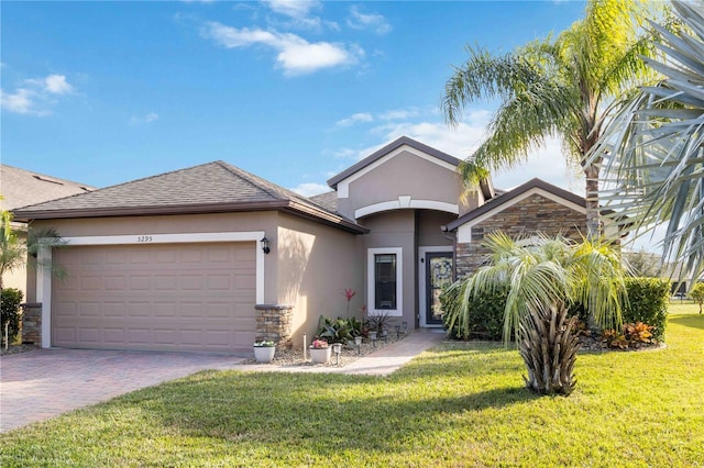 view of front facade with a garage and a front yard