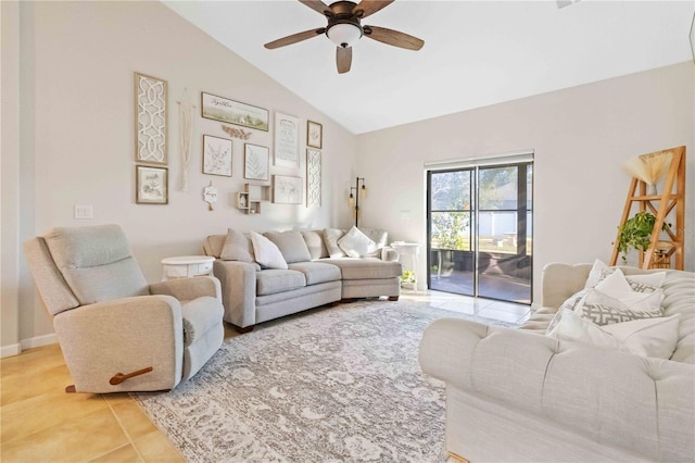 living room with ceiling fan, tile patterned floors, and vaulted ceiling