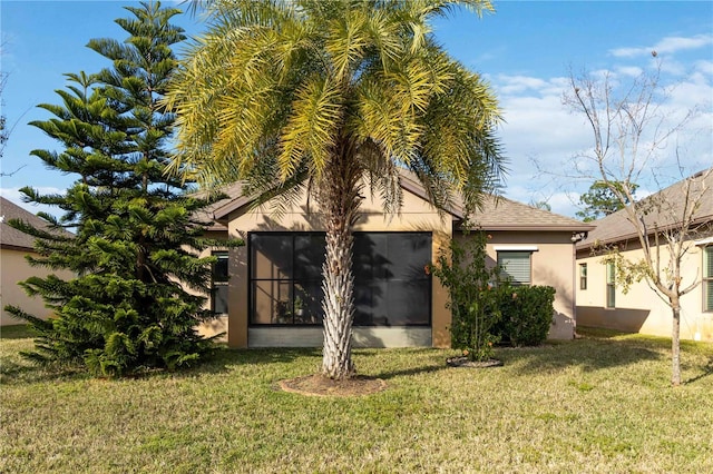 rear view of property with a yard