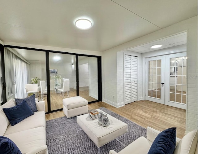 living room featuring wood-type flooring and french doors