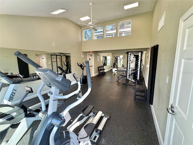 exercise room with lofted ceiling and ceiling fan