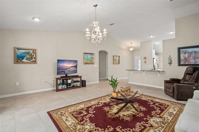 living room featuring arched walkways, light tile patterned floors, lofted ceiling, a chandelier, and baseboards