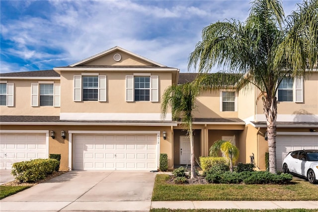 multi unit property featuring a garage