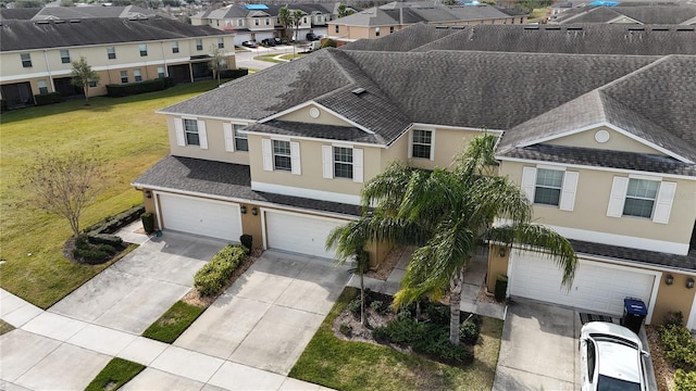 view of front of home featuring a garage and a front yard