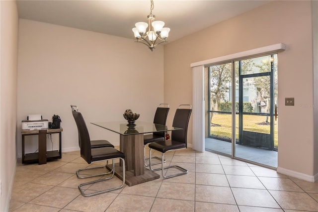 dining area featuring an inviting chandelier and light tile patterned flooring