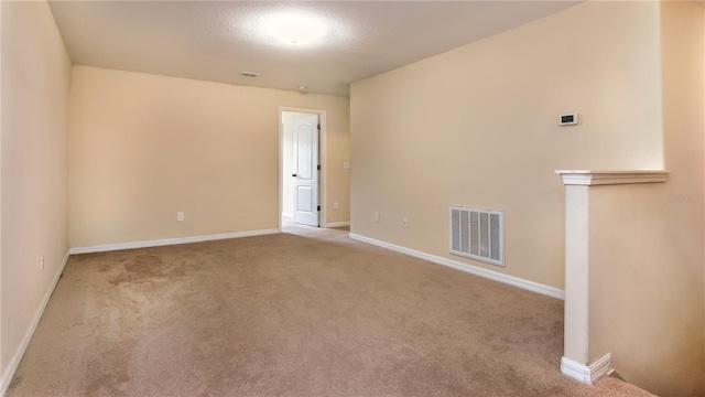 unfurnished room with light carpet