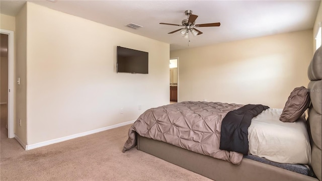 bedroom with ceiling fan and light colored carpet