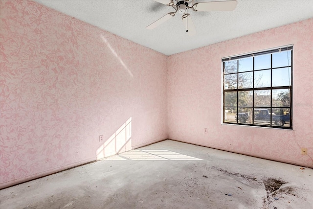 spare room with ceiling fan