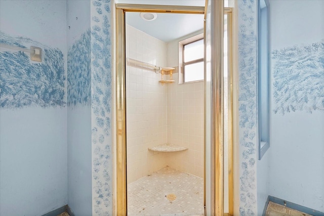 bathroom with a shower with shower door