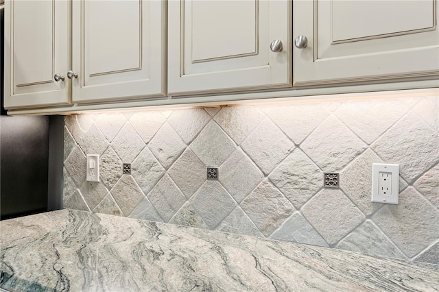 interior details with light stone counters and cream cabinets