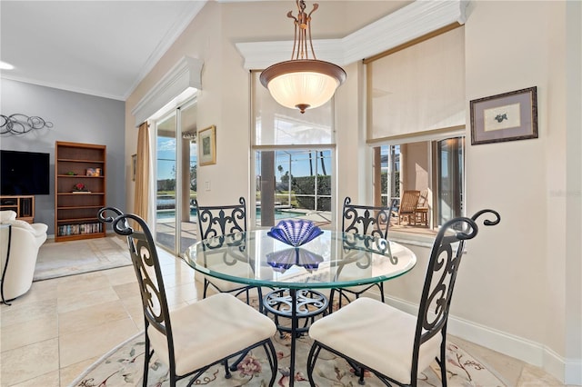 dining area with crown molding and light tile patterned floors