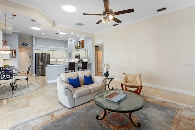 tiled living room featuring ornamental molding and ceiling fan