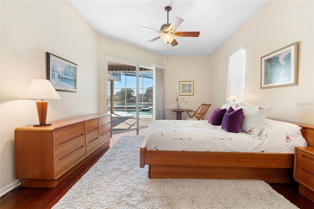 bedroom with dark hardwood / wood-style floors, access to outside, and ceiling fan