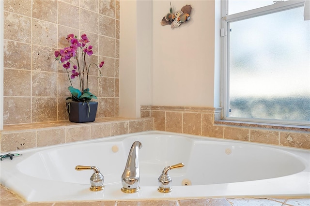 bathroom featuring tiled tub