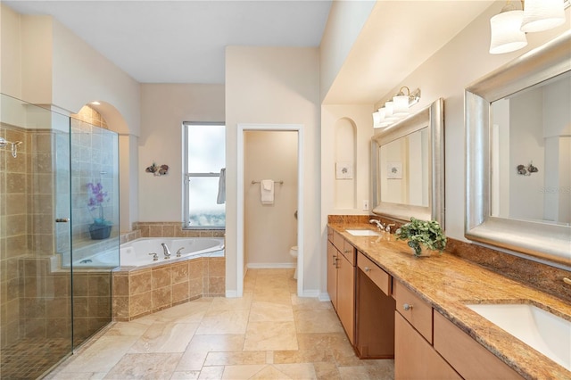 full bathroom featuring vanity, plus walk in shower, and toilet