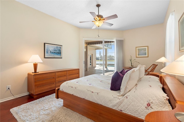 bedroom with dark hardwood / wood-style floors, access to outside, and ceiling fan