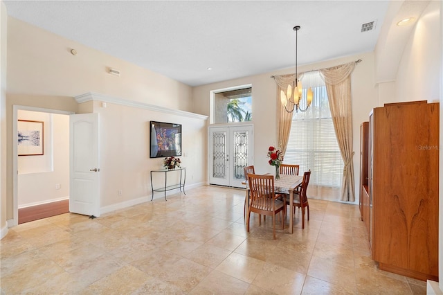 dining space with a chandelier