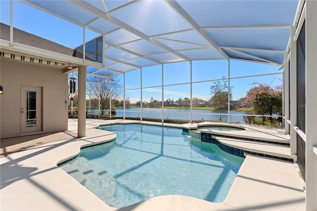 view of pool featuring a lanai, a patio area, a water view, and an in ground hot tub