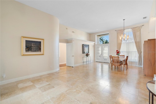 dining space with an inviting chandelier