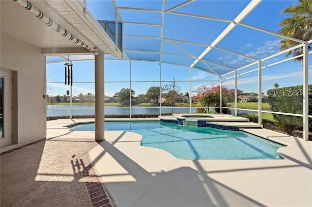 view of pool with a patio, an in ground hot tub, a water view, and glass enclosure