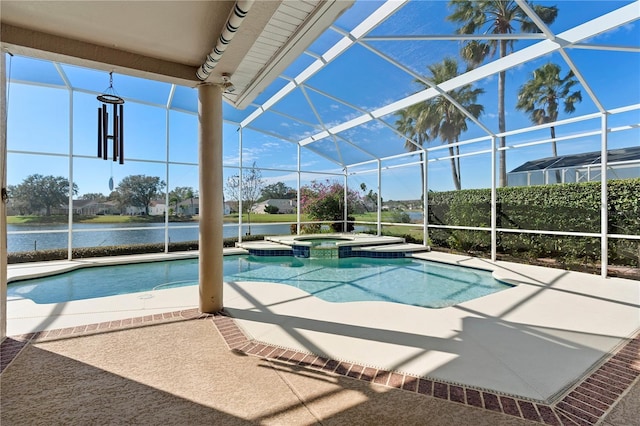 view of pool featuring an in ground hot tub, a water view, a lanai, and a patio