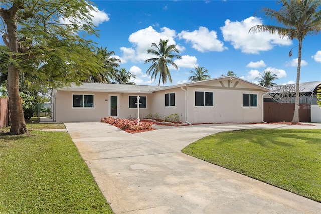 single story home with a front yard