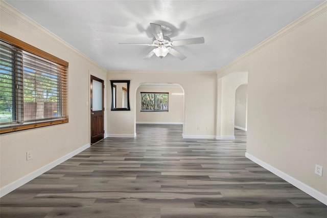 unfurnished room with dark hardwood / wood-style flooring, crown molding, and ceiling fan