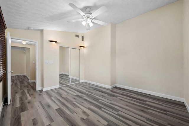 spare room with ceiling fan, lofted ceiling, and dark hardwood / wood-style flooring