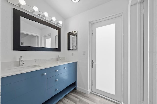 bathroom featuring vanity and wood-type flooring