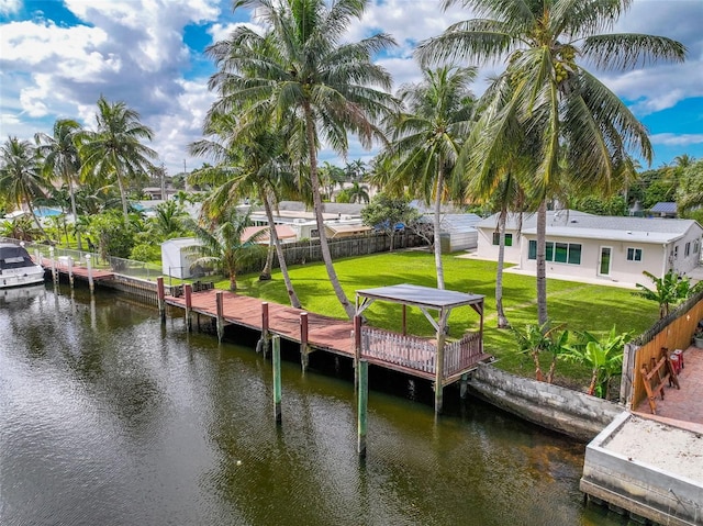 dock area featuring a yard and a water view