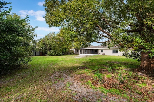 view of yard with a sunroom