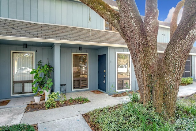 view of exterior entry with covered porch