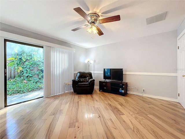 sitting room featuring ceiling fan and light hardwood / wood-style flooring