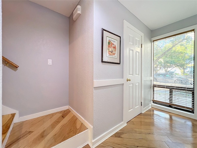 interior space with light hardwood / wood-style floors and a wealth of natural light