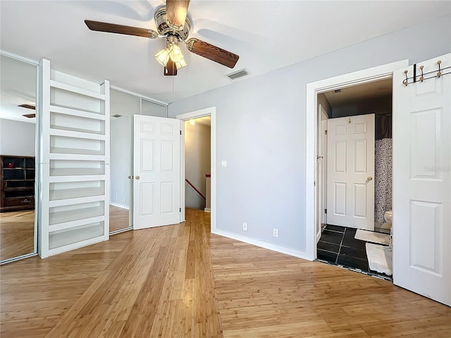 unfurnished bedroom with light hardwood / wood-style flooring and ceiling fan