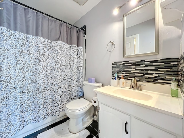 bathroom with vanity, backsplash, tile patterned flooring, and toilet