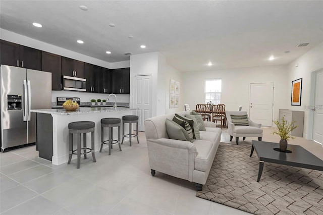 living room with light tile patterned floors