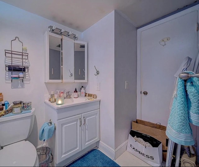 bathroom with vanity and toilet