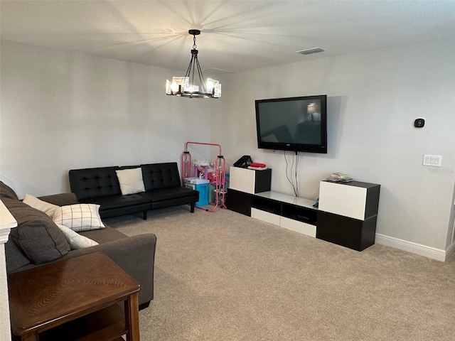 living room featuring light colored carpet and an inviting chandelier