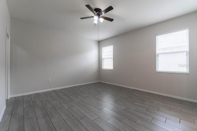 empty room with plenty of natural light and ceiling fan